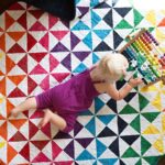 Baby Playing On Pre Cut Quilt